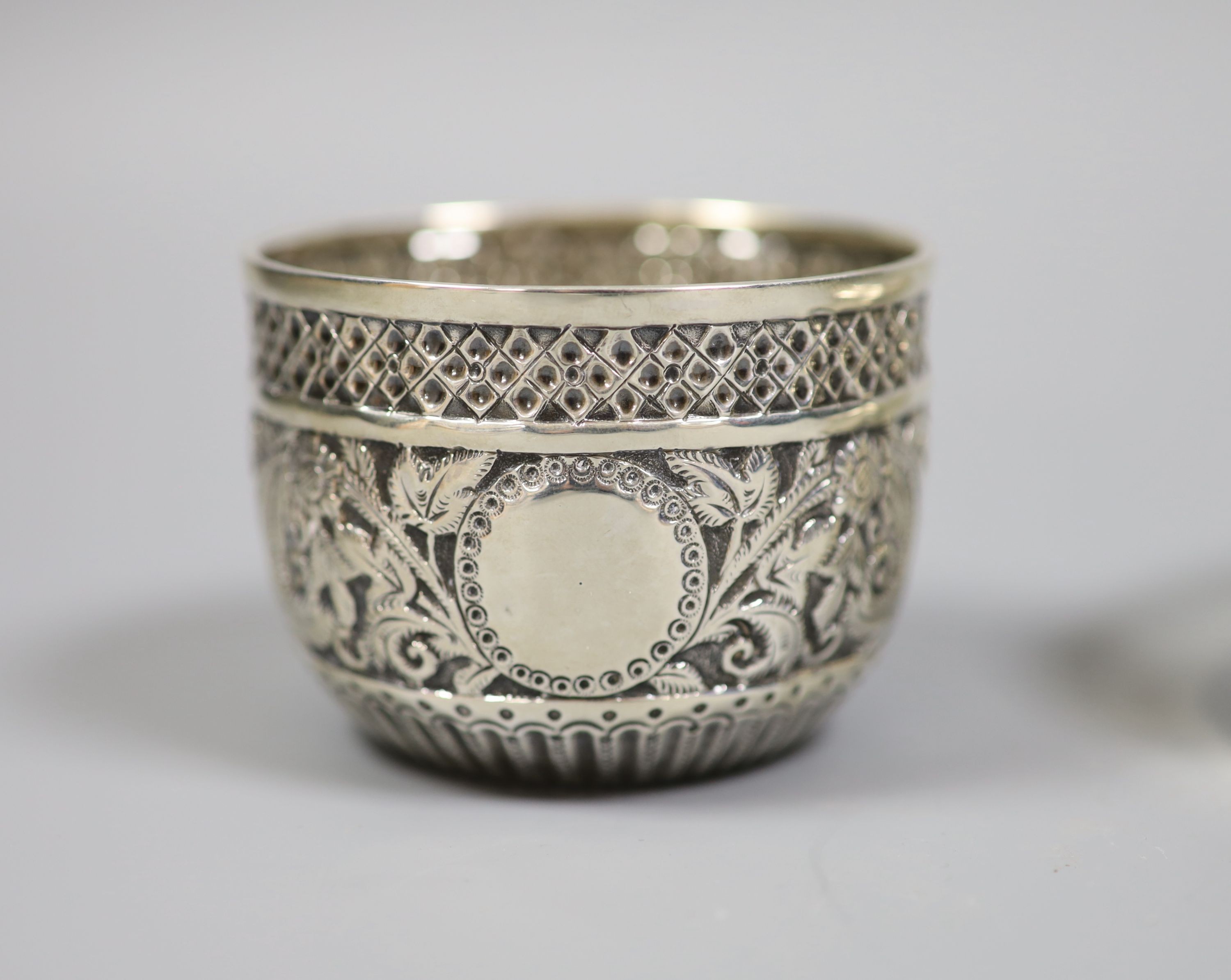 A late Victorian repousse silver bowl, London, 1898, diameter 8cm, a modern silver mounted circular trinket box, Birmingham, 1976 and a christening knife and fork, the knife with silver blade.